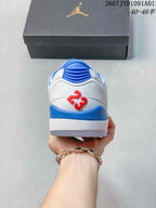 Rear view of the sneaker with blue heel accents and a red number detail