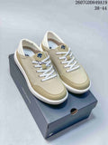 Pair of beige DESCENTE sneakers displayed on a branded shoe box, with style code 2607GDD849A19 and size range 38–44 visible above.