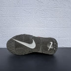 Underside view of the dark outsole and visible Nike branding