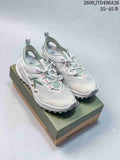 White Keen Zionic ADV low-top hiking shoes with green and pink accents, shown on a shoe box