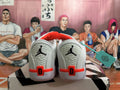 Rear view of white basketball shoes with black heel logos and red accents