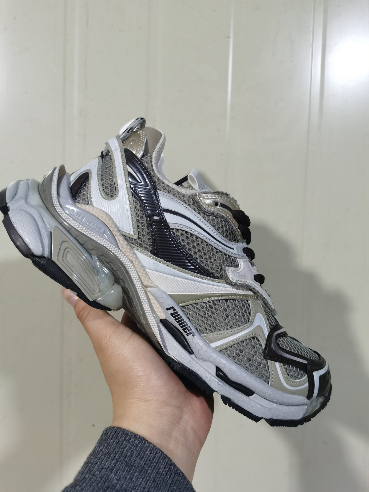 Side view showing the layered mesh-style upper, contrasting overlays, Puma branding, and sculpted sole.