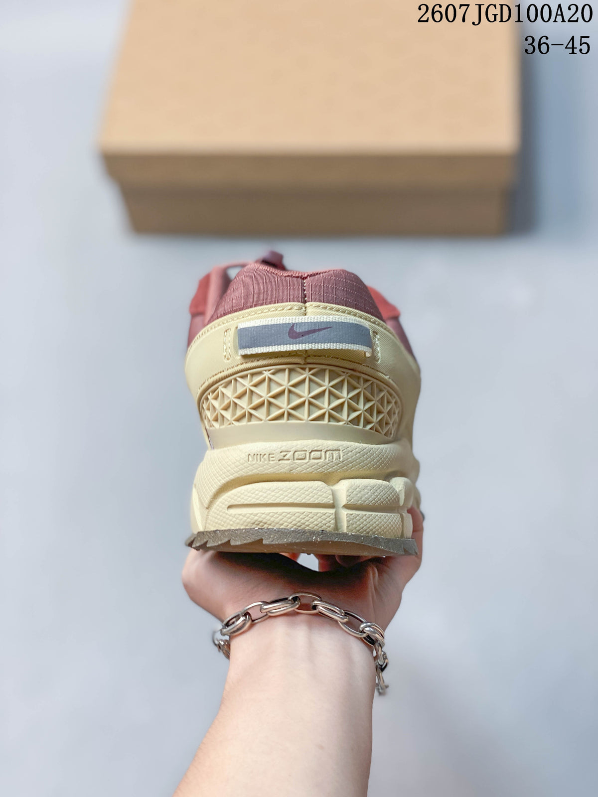 Rear view showing the Nike heel label, textured heel structure, and Zoom-branded midsole.