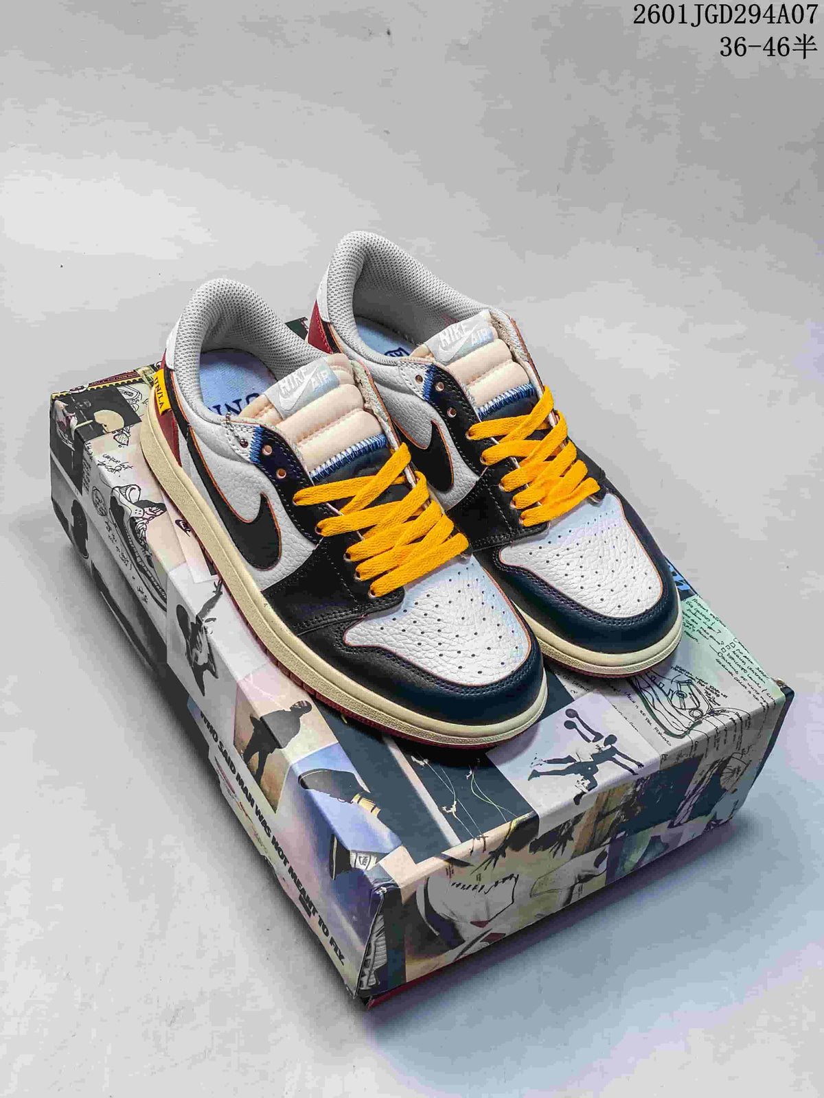 White and dark-panel low-top sneakers with yellow laces on a graphic shoe box