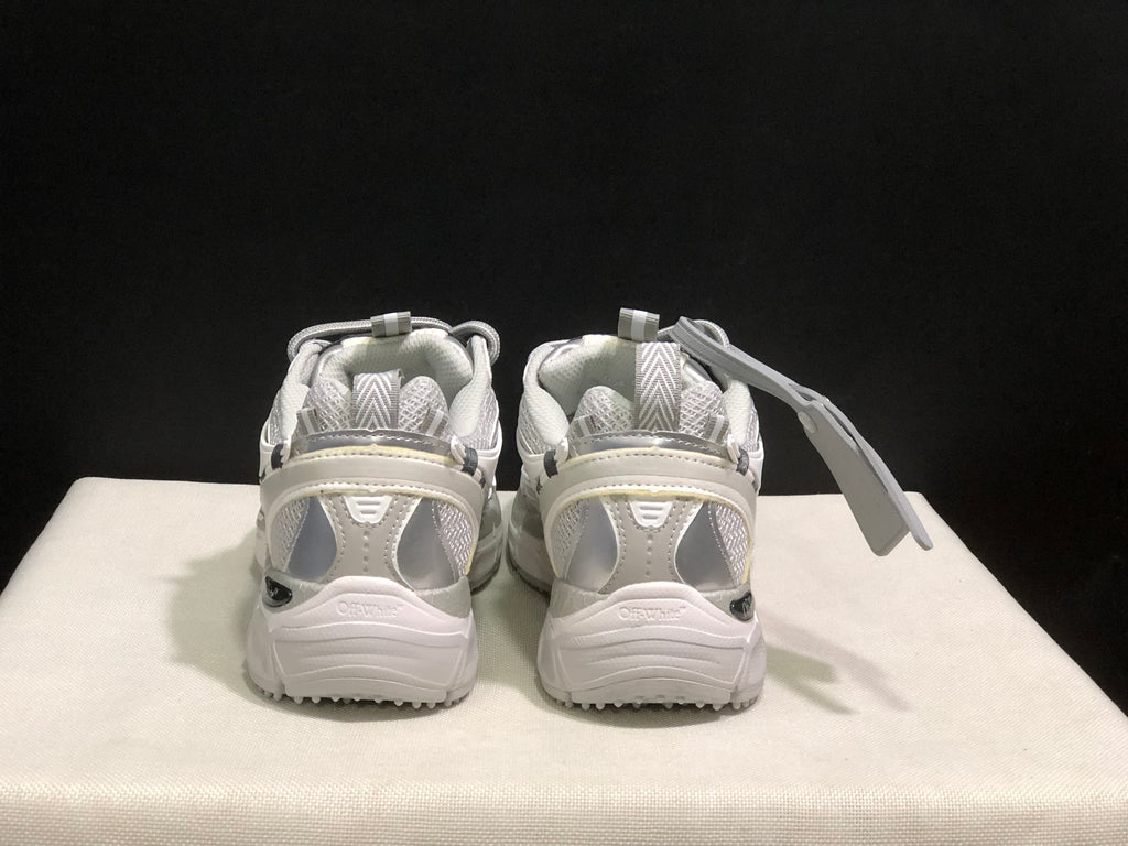 Rear view of the pair showing padded heel sections, pull tabs, layered heel panels, and visible branding.
