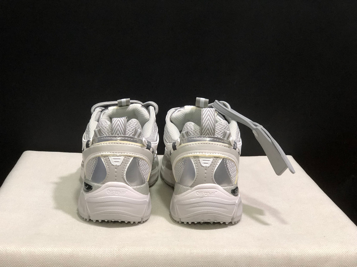 Rear view of the pair showing padded heel sections, pull tabs, layered heel panels, and visible branding.