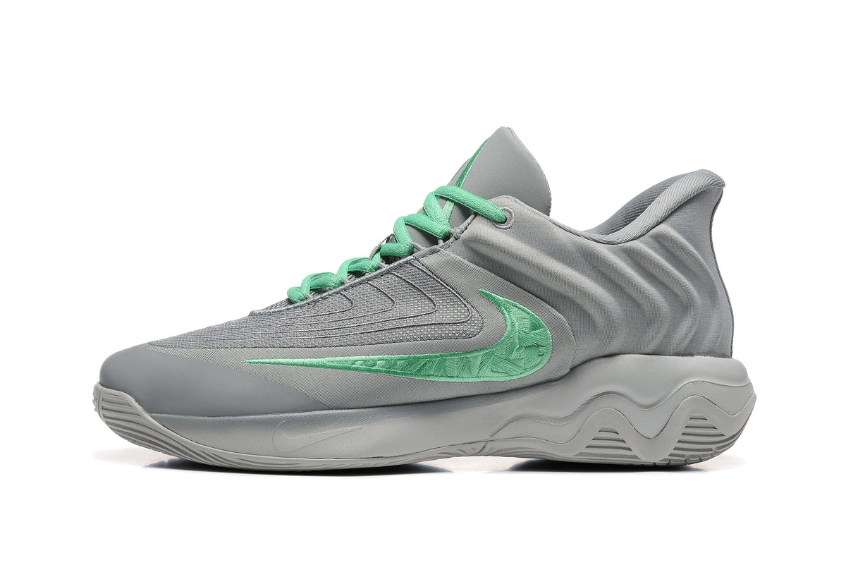 Side profile highlighting the mint-green emblem and textured gray upper