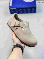 Pale neutral closed-toe sandal with two buckle straps; size range text appears in the image.