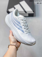 Side view of a white Adidas sneaker with blue layered side detailing and Dreamsstrike text on the midsole.