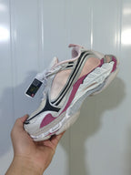 Side and sole view of the Balenciaga Triple S 2 sneaker, highlighting its gradient mesh panels and sculpted layered outsole.
