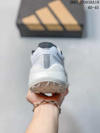 Rear view of the shoe showing the padded heel, white midsole and textured outsole.