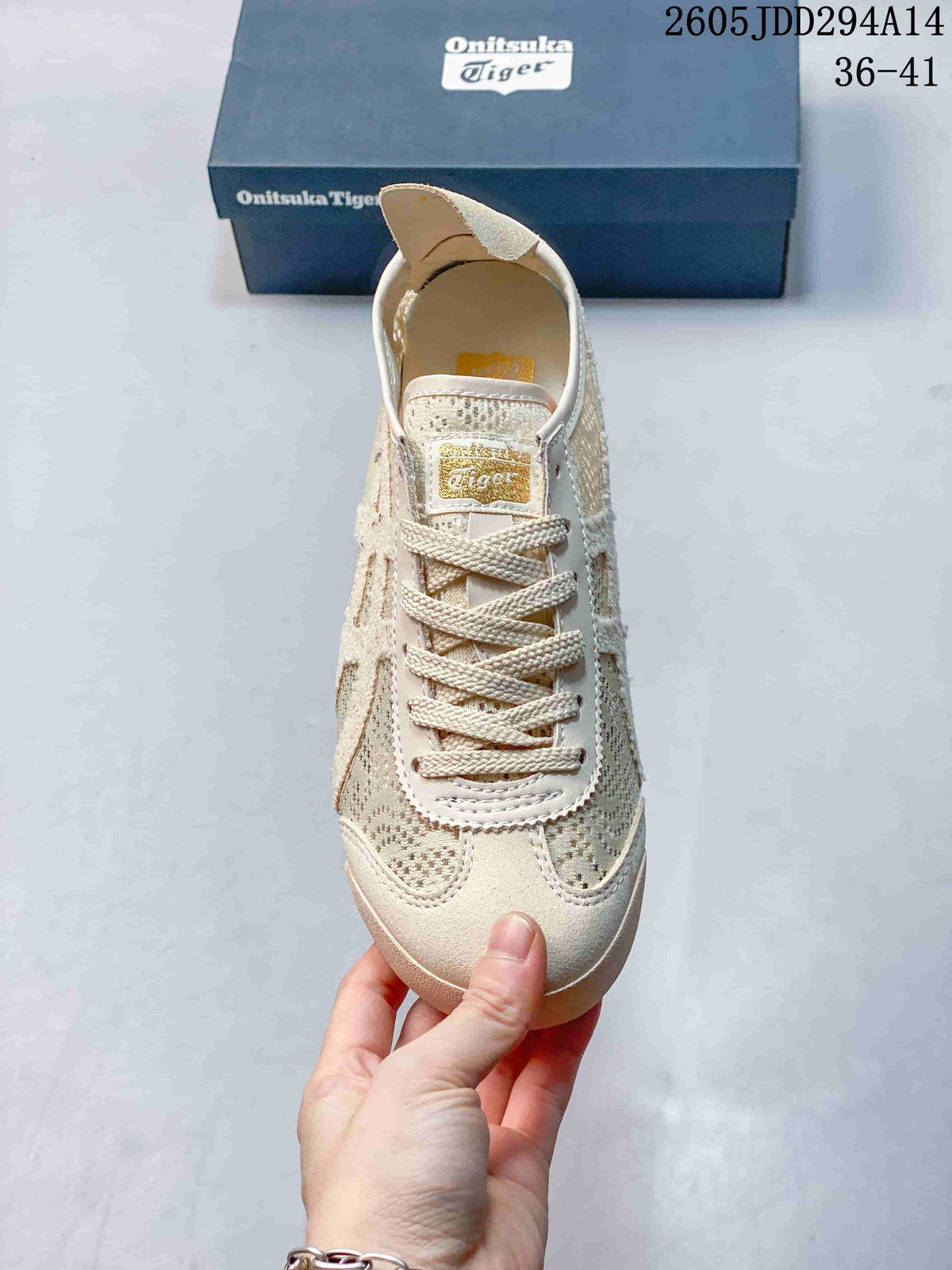 Top view of the sneaker showing the rounded toe, lace-up fastening, tongue label, and patterned textile panels.