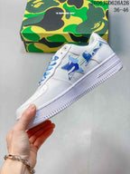 Side profile showing the white low-top construction and layered blue pastel star details.