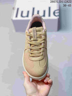 Top view of the tan sneaker showing the lace-up design, padded collar and tonal tongue detail.