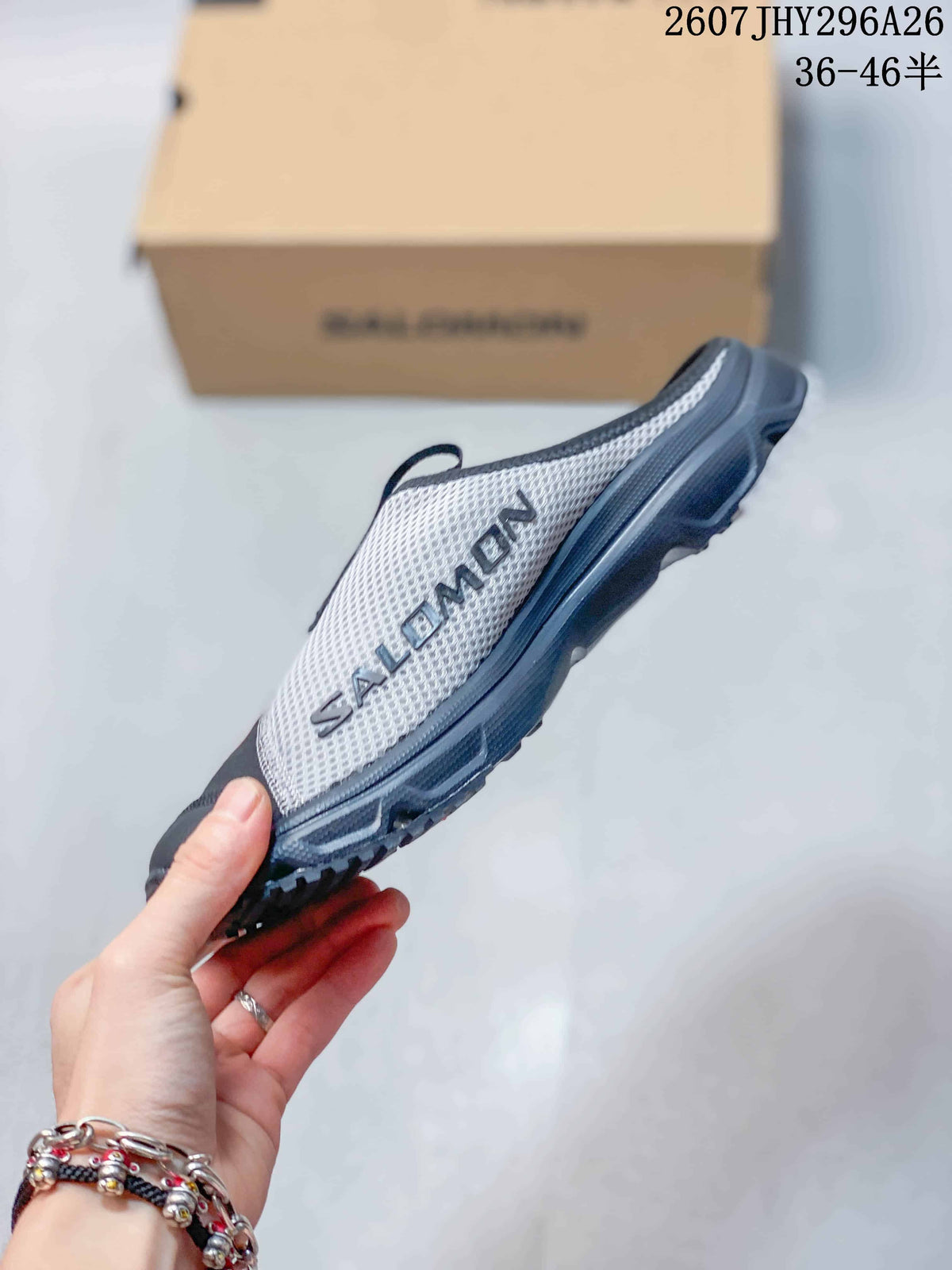 Side profile of the Salomon RX Slide 3.0 mule showing the gray mesh upper, black sole, and Salomon branding.