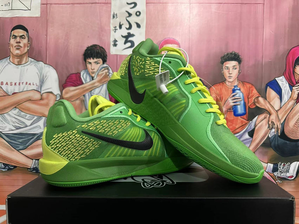 Pair of green Nike basketball shoes with black Swoosh logos and bright yellow-green laces.