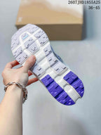 Close-up of the Cloudvista 2 outsole showing segmented gray and purple traction sections with geometric tread patterns.