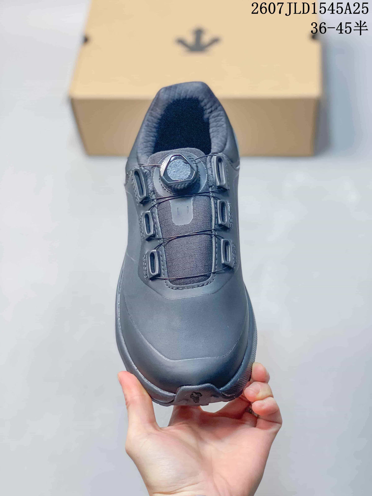 Top view of the black sneaker showing the dial-style fastening, tongue and rounded toe.