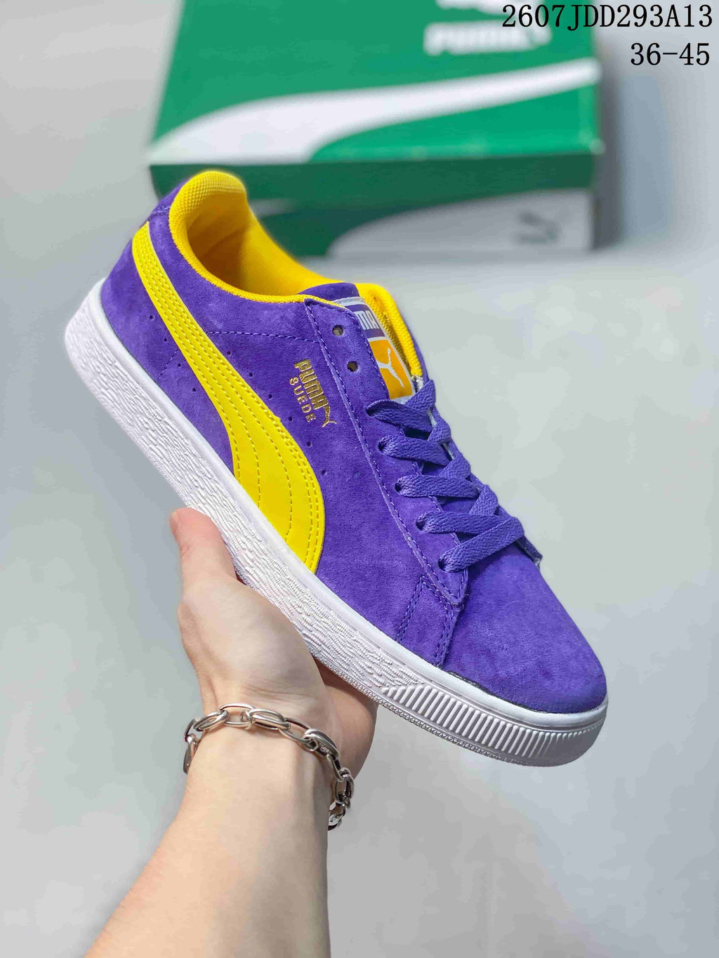 Purple PUMA Suede XL sneaker with yellow side stripes, yellow lining and a white outsole.