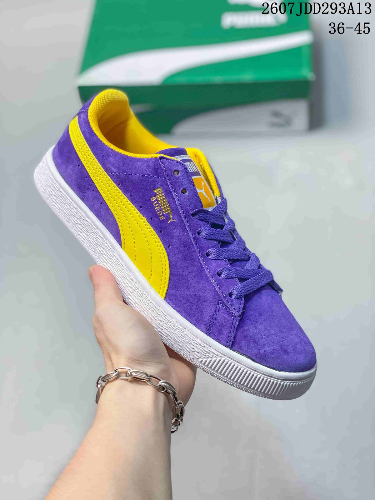 Purple PUMA Suede XL sneaker with yellow side stripes, yellow lining and a white outsole.