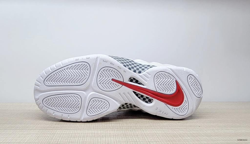 Underside view showing the white outsole and red Nike Swoosh
