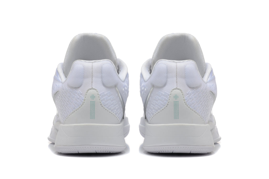 Rear view of white basketball shoes with textured heel panels and teal details.