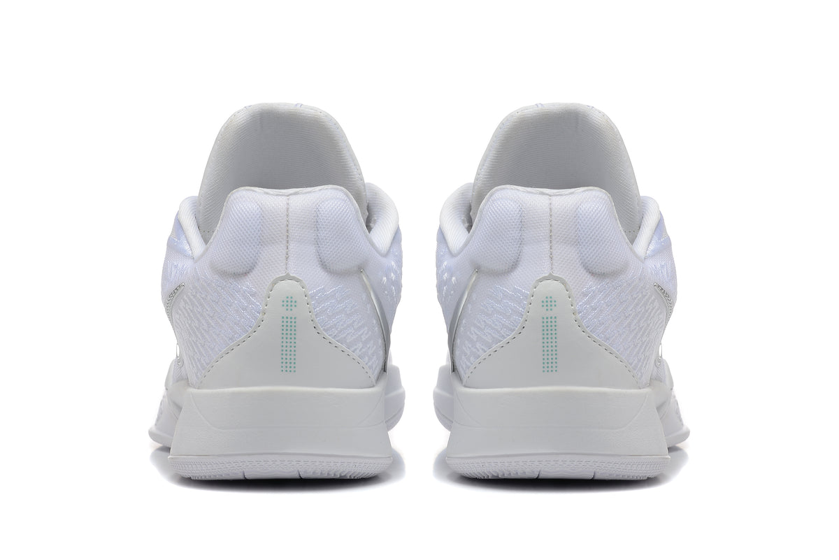 Rear view of white basketball shoes with textured heel panels and teal details.