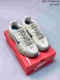 Pair of cream and navy Nike P-6000 sneakers displayed on a red shoebox.