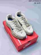 Pair of cream and navy Nike P-6000 sneakers displayed on a red shoebox.