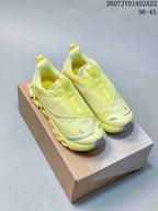 Pair of lime yellow On Cloud X 4 sneakers displayed on a shoebox, with the source-listed style code and size range visible above.