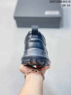 Rear view of the sneaker showing the padded heel, pull tab, layered midsole, and rugged outsole.