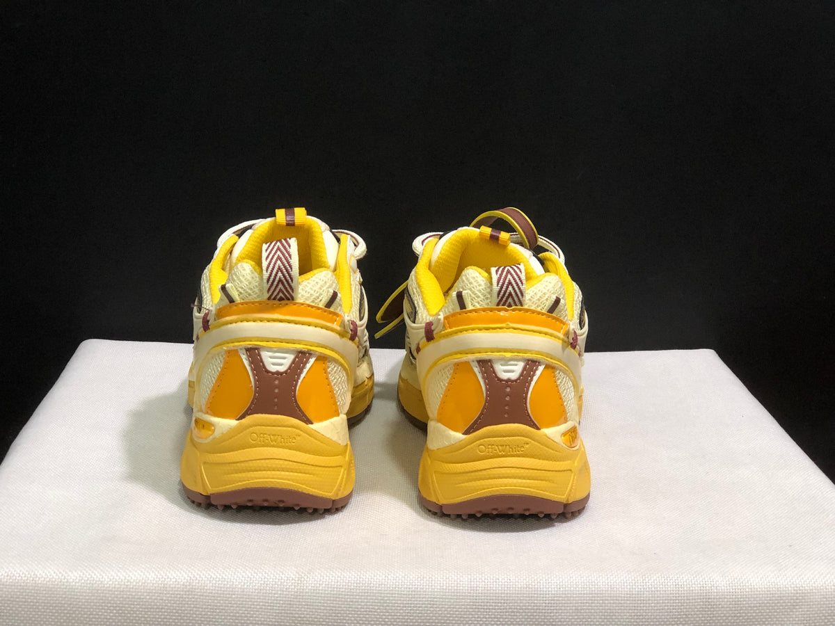 Rear view of the pair showing yellow heel padding, brown-and-yellow heel panels, and textured soles.