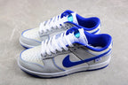 Angled view of the pair showing blue collars, white uppers, blue side branding, and white midsoles.