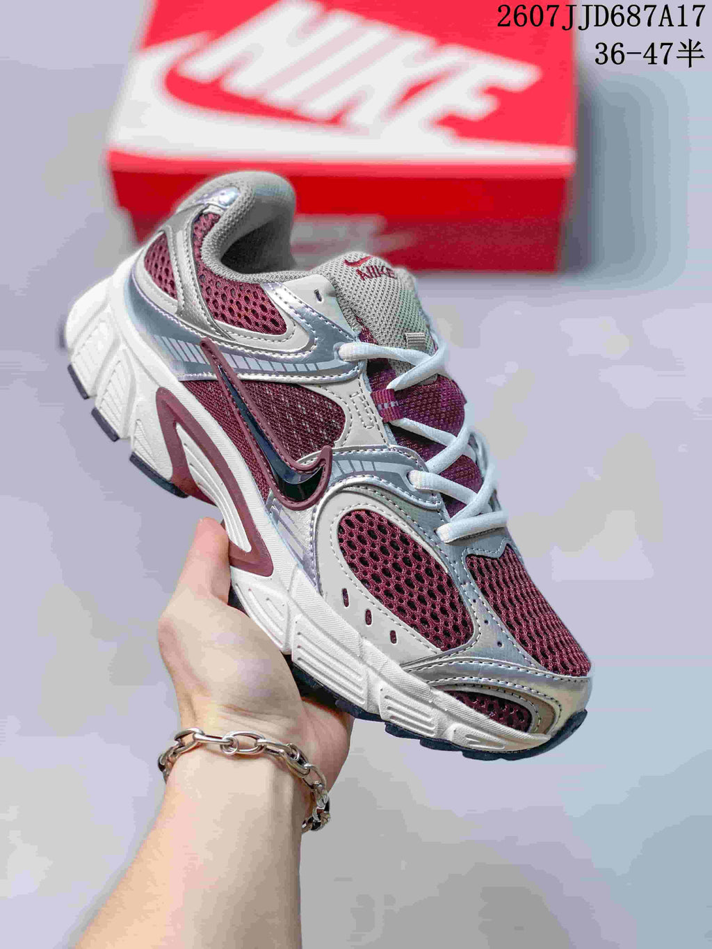 White Nike V5 RNR sneaker with burgundy mesh and accent details.