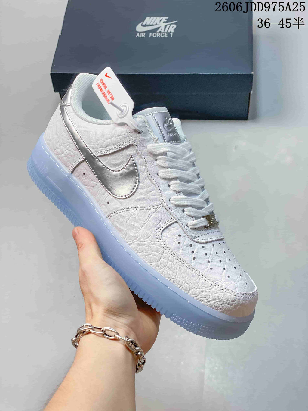 Side view of a white Air Force 1 sneaker with silver Swoosh and icy blue sole