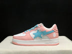 Side profile of a pink and white low-top sneaker with a light-blue star-shaped side emblem and pink outsole.