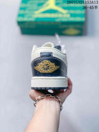 Rear view showing the dark navy heel panel, gold winged basketball emblem, and white midsole.
