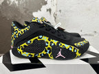 Side view of a Jordan Luka 1 shoe showing patterned panels and pink Jumpman detail
