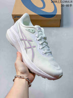 Angled side view of the white and lilac ASICS running shoe showing the branding, upper texture and outsole.