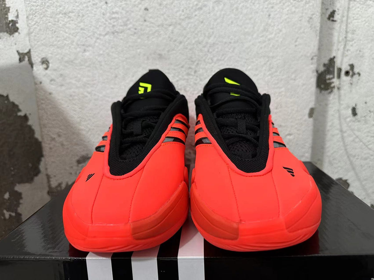 Front view of red and black Adidas Dame 9 basketball shoes