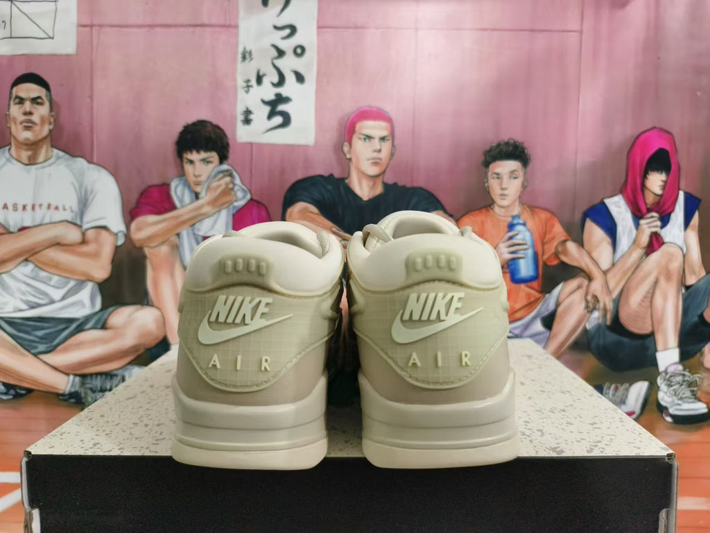 Rear view of beige Nike sneakers showing Nike Air heel branding.