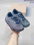 Pair of dark gray On kids' sneakers shown from a front three-quarter angle, with the Cloudstratus-style branding visible.