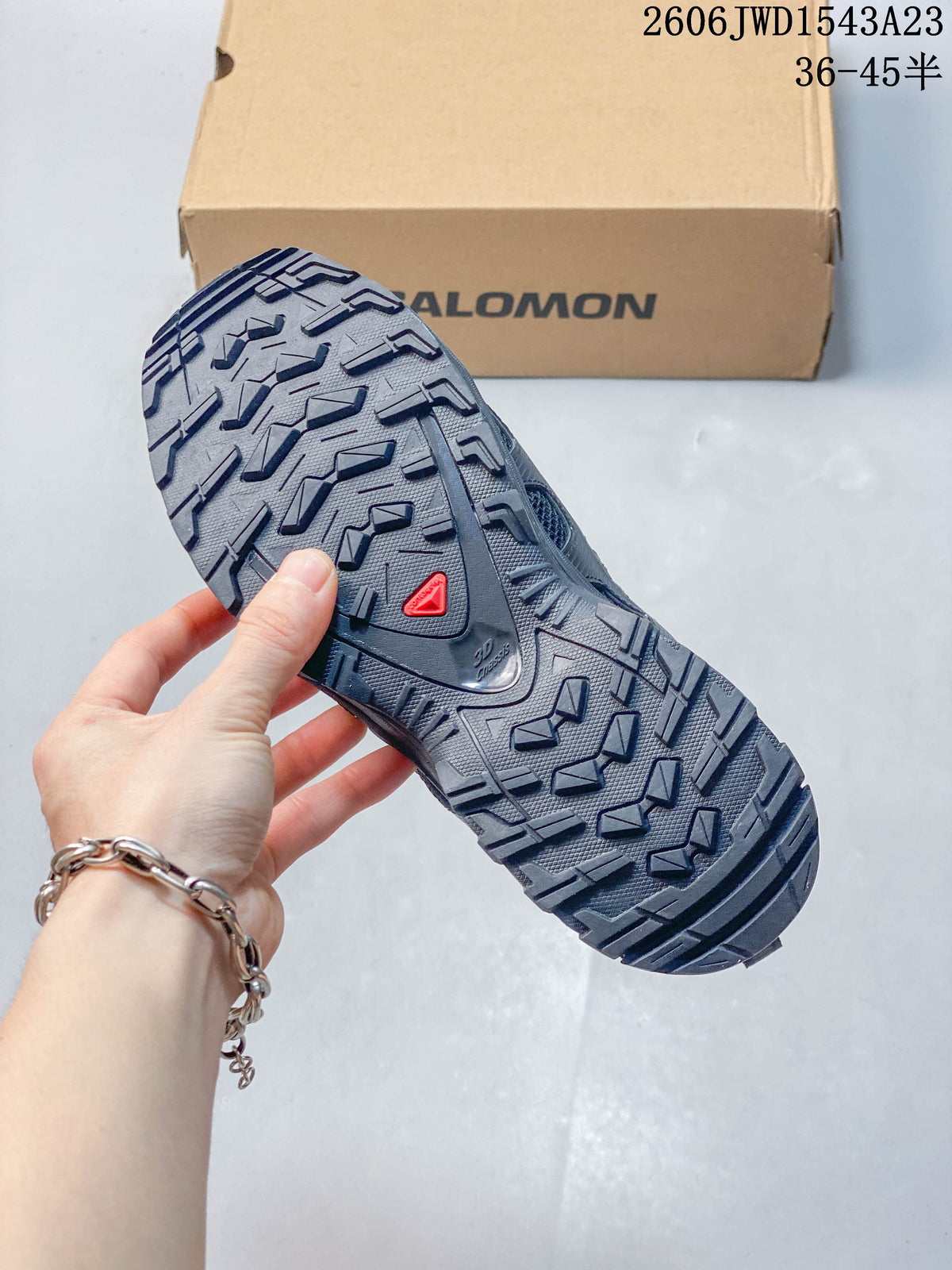 Close-up of the dark gray shoe outsole and tread