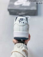 Rear view showing the white heel, Nike Air branding, dark outsole edge, and side graphic detail.