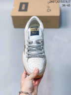 Top view showing the perforated toe, gray laces, and branded tongue label.