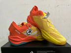 Two yellow and orange Adidas Adizero shoes shown from angled side and top views