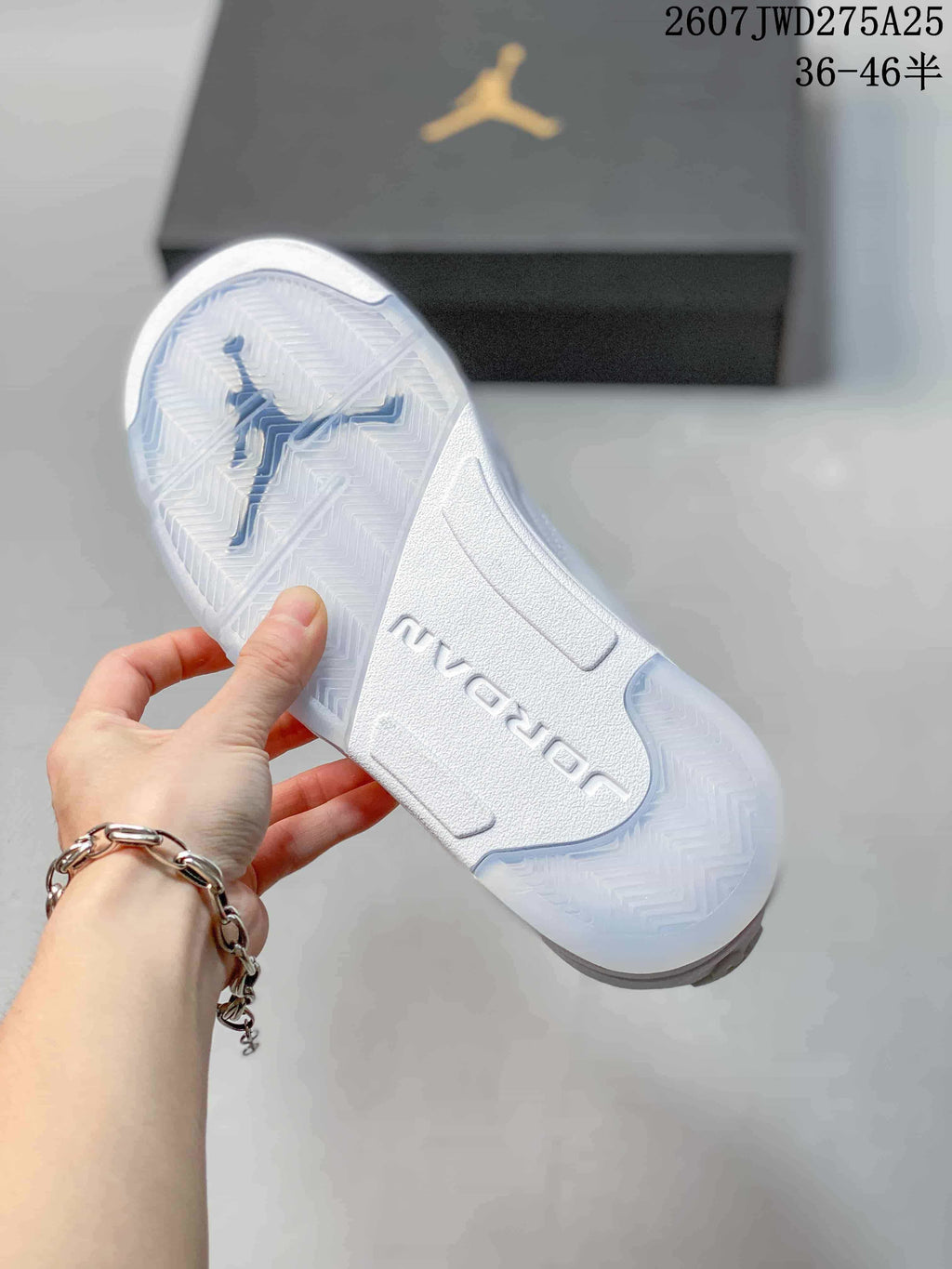 Underside view showing the white outsole, translucent traction sections and Jordan branding.