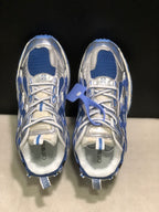 Top-down view showing the blue mesh sections, silver overlays, white laces, and branded insoles.