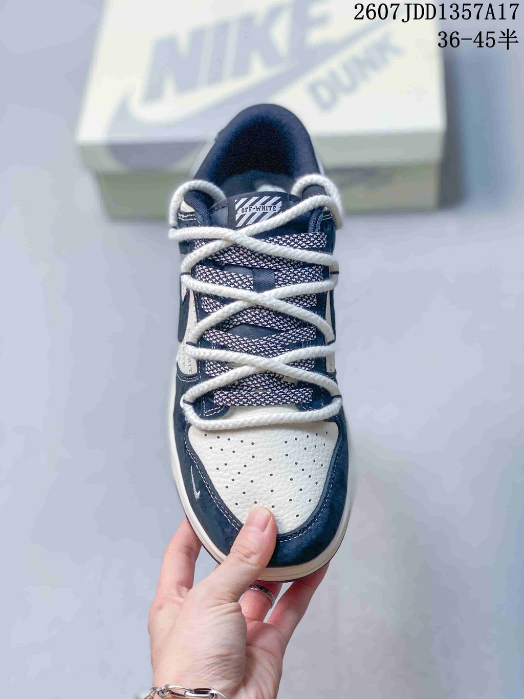 Top-down view of the sneaker showing the perforated white toe box and multiple rope-lace crossings.