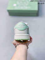 Rear view of the sneaker showing a mint green heel panel, white textured upper, and green outsole edge.